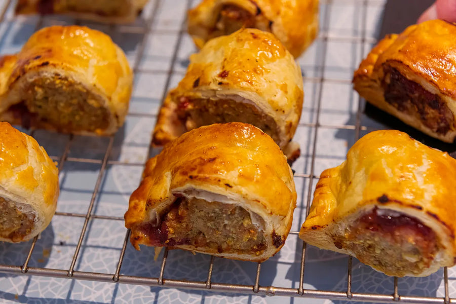 Mrs. Ruth's Spicy Sausage Rolls on a cooling rack