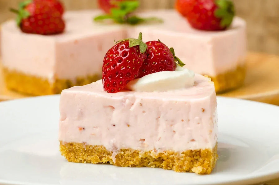 A slice of Mrs. Ruth's No Bake Strawberry Icebox Pie with a golden graham cracker crust, topped with fresh strawberries