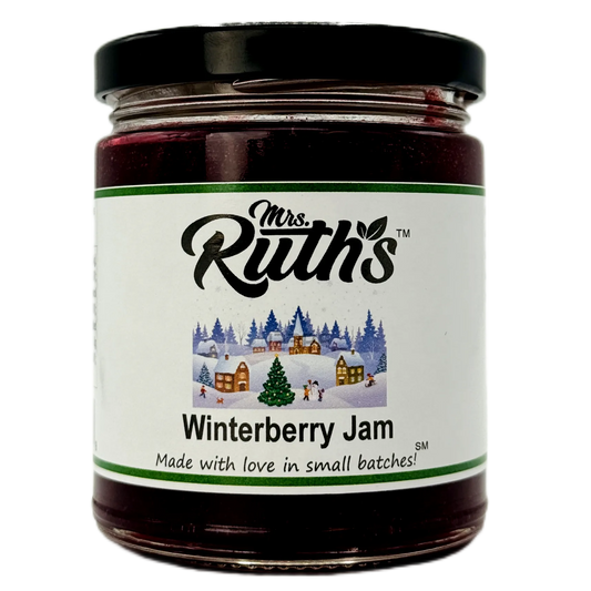 A jar of Mrs. Ruth's Winterberry Jam with a black lid and a white label featuring a winter village illustration, set against a plain white background.